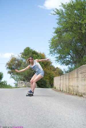 18 year old girl Megan Rain removes her sandals and then clothes to pose naked